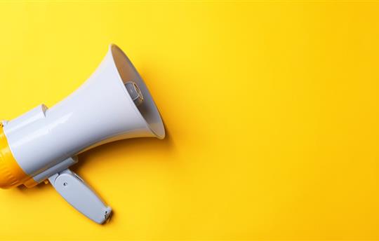 megaphone on a bright yellow background